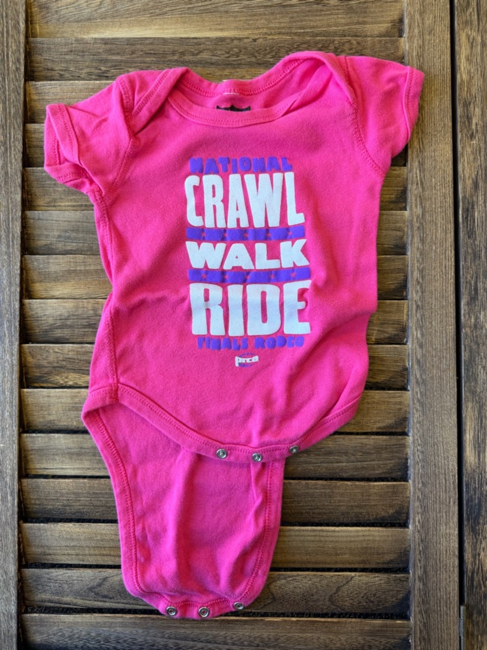 Wrangler PRCA NFR Hot Pink Graphic 'Crawl Walk Ride' Baby One-Piece 12 Months